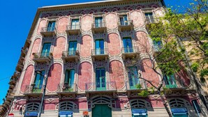 A multi-story building with ornate architectural details, including balconies and decorative moldings. - Bed & Breakfast Ipnos (Catania)