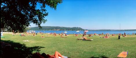 On the beach, sun loungers, beach umbrellas, beach volleyball