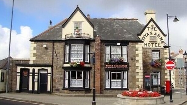 The Ivan Arms Hotel with a traditional stone facade, a signboard for breakfast, and a no entry sign visible. - The Vyvyan Arms Hotel (Camborne)
