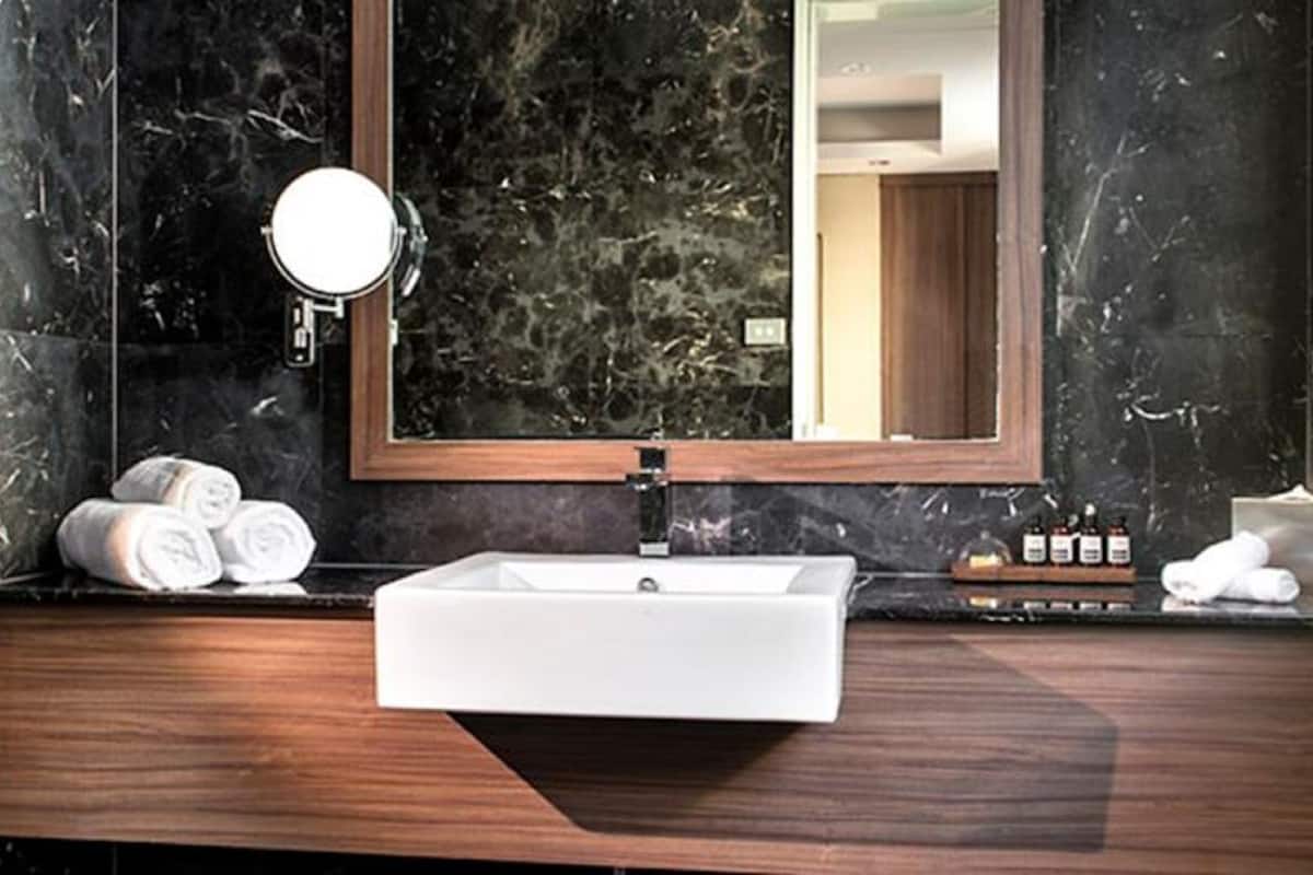 stateroom with complimentary continental breakfast | bathroom | shower, designer toiletries, hair dryer, towels