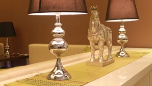 A table with two lamps and a horse-shaped lamp base. - Bella Hotel Surabaya (Surabaya)