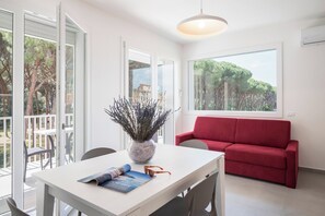 Family Suite, 2 Bedrooms | Living area | TV - Hotel La Pineta (Follonica)