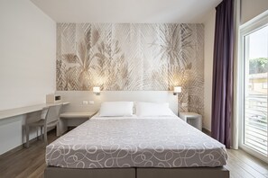 Triple Room | Minibar, in-room safe, desk, blackout curtains