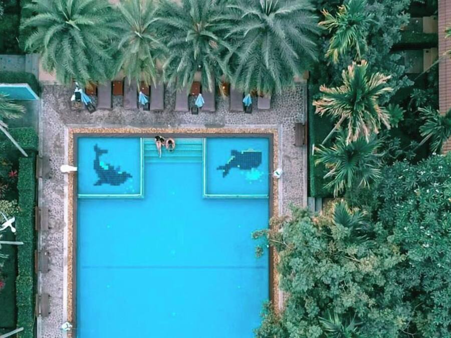 2 outdoor pools, open 9:00 AM to 6:30 PM, pool umbrellas