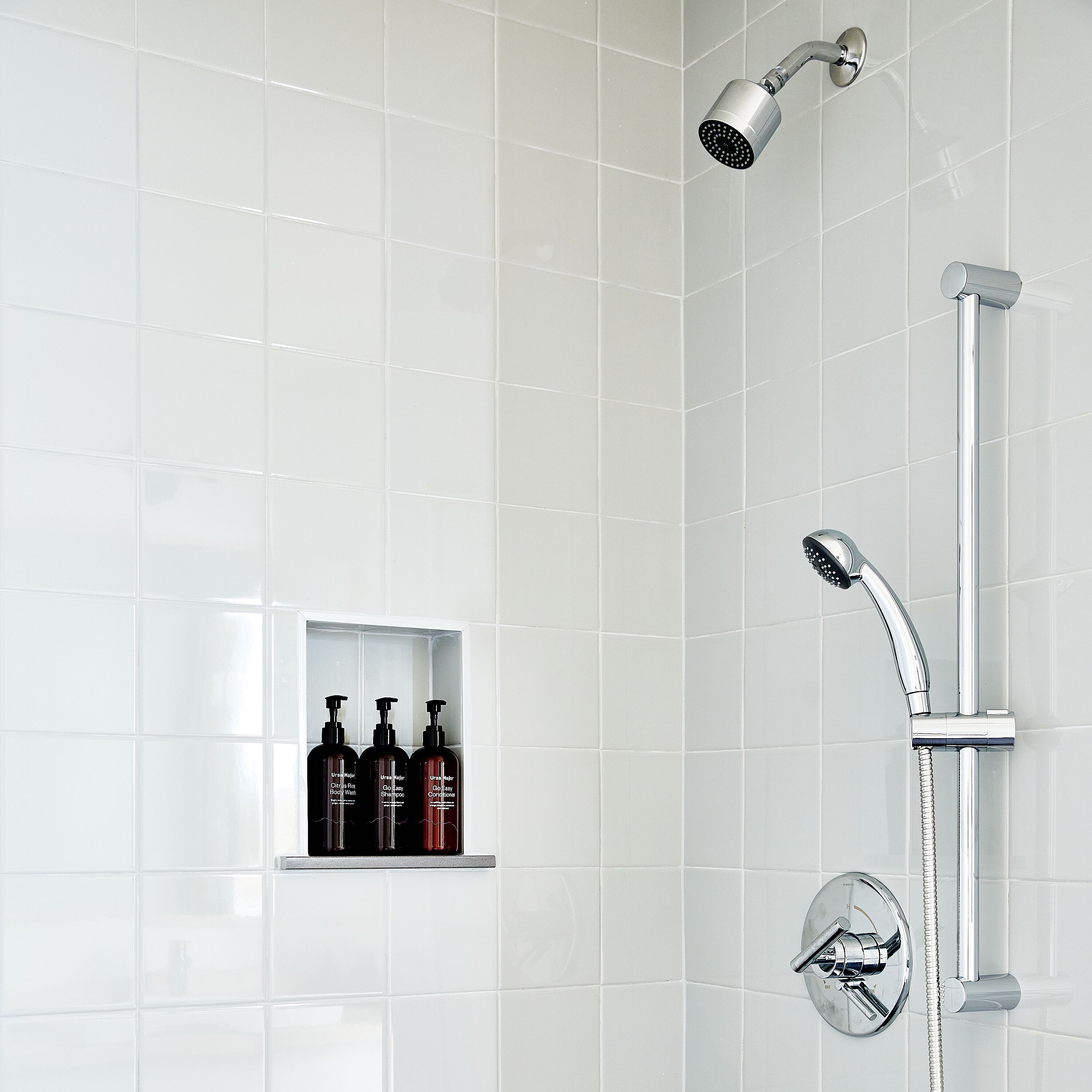 combined shower/bathtub, designer toiletries, hair dryer, towels
