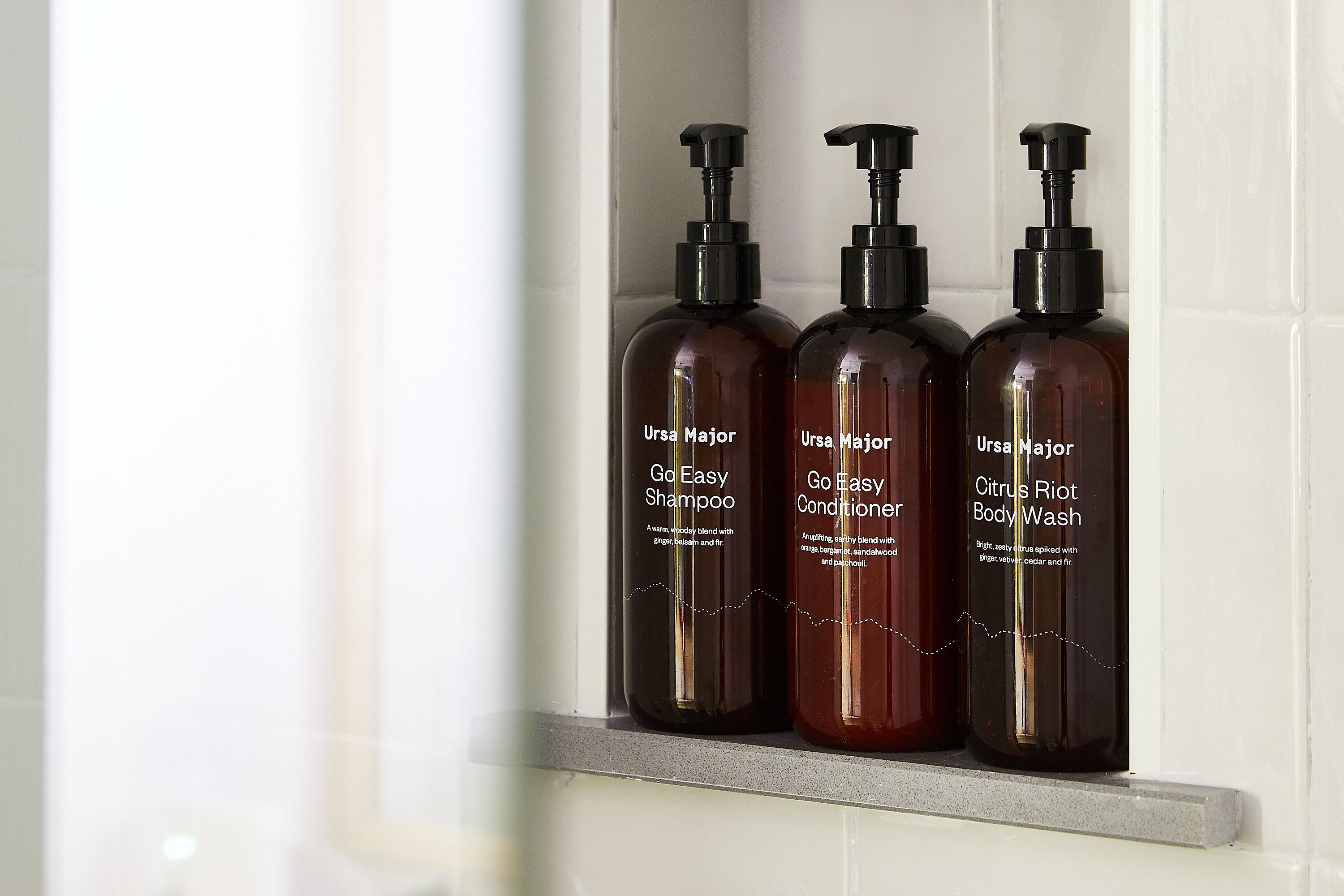 combined shower/bathtub, designer toiletries, hair dryer, towels