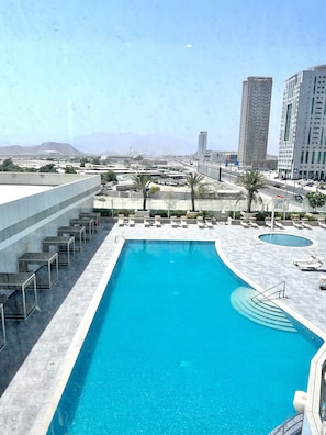 Outdoor pool, free cabanas, pool umbrellas