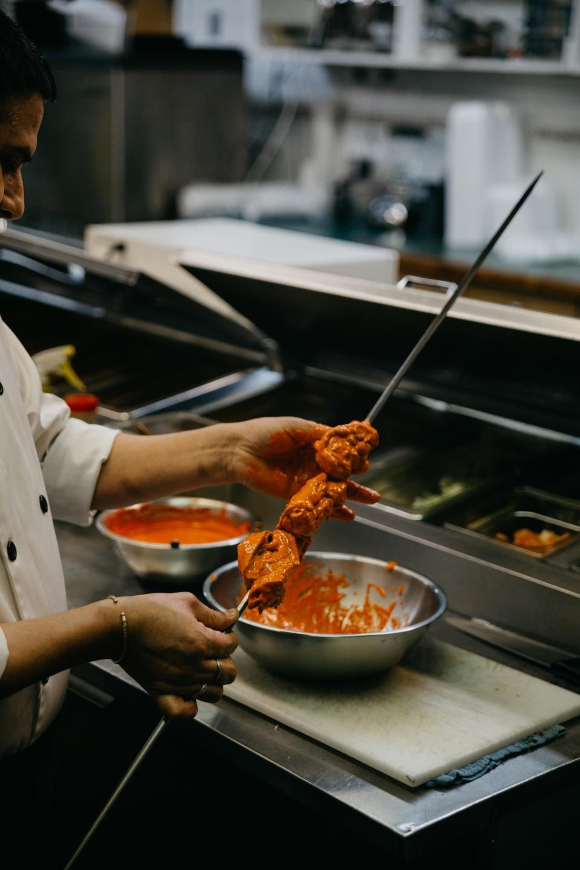 A person preparing food in a kitchen.