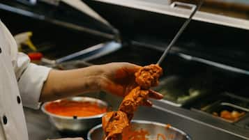 A person preparing food in a kitchen.