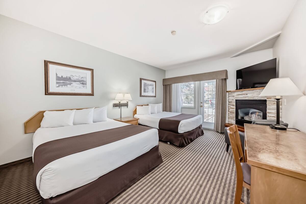 Premium bedding, desk, laptop workspace, blackout drapes