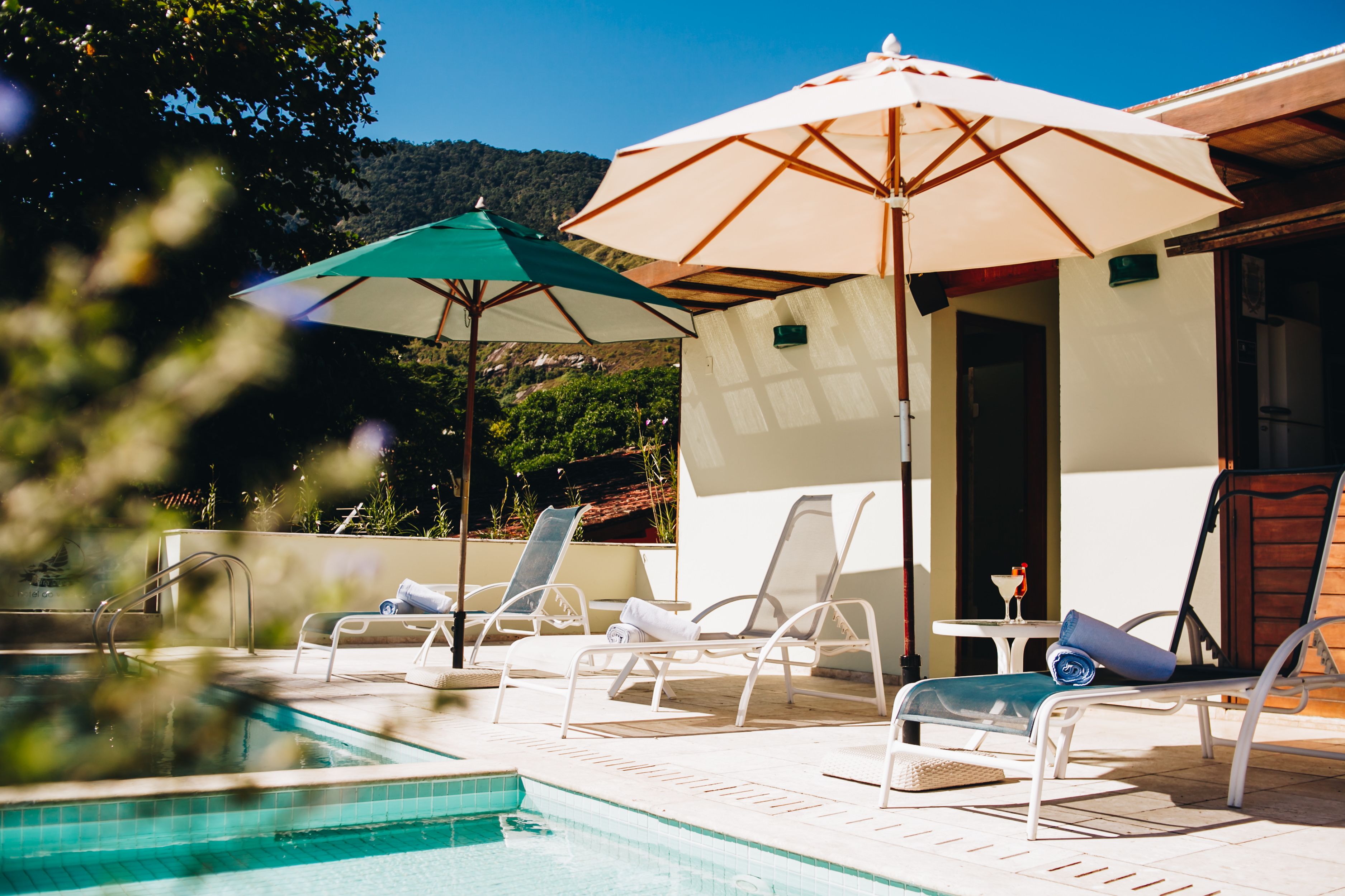 outdoor pool, pool umbrellas, pool loungers