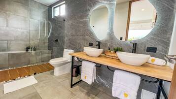 Suite, City View | Bathroom | Shower, free toiletries, hair dryer, towels