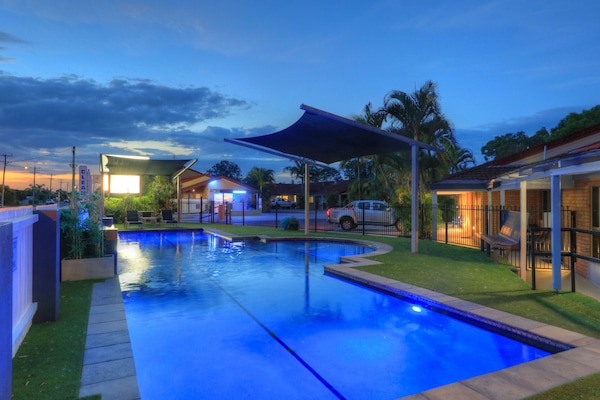 Outdoor pool, open 8:00 AM to 9:00 PM, pool loungers