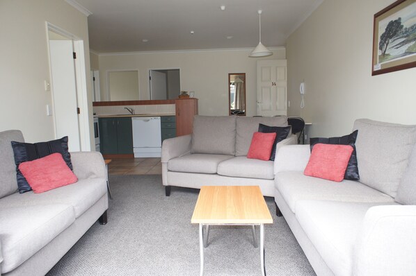 3 Bedroom Unit | Living area | Smart TV, DVD player - Bks Egmont Motor Lodge (New Plymouth)