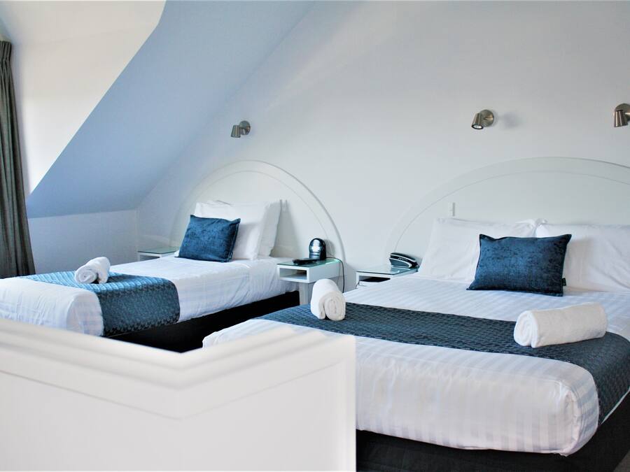 Premium bedding, desk, laptop workspace, soundproofing