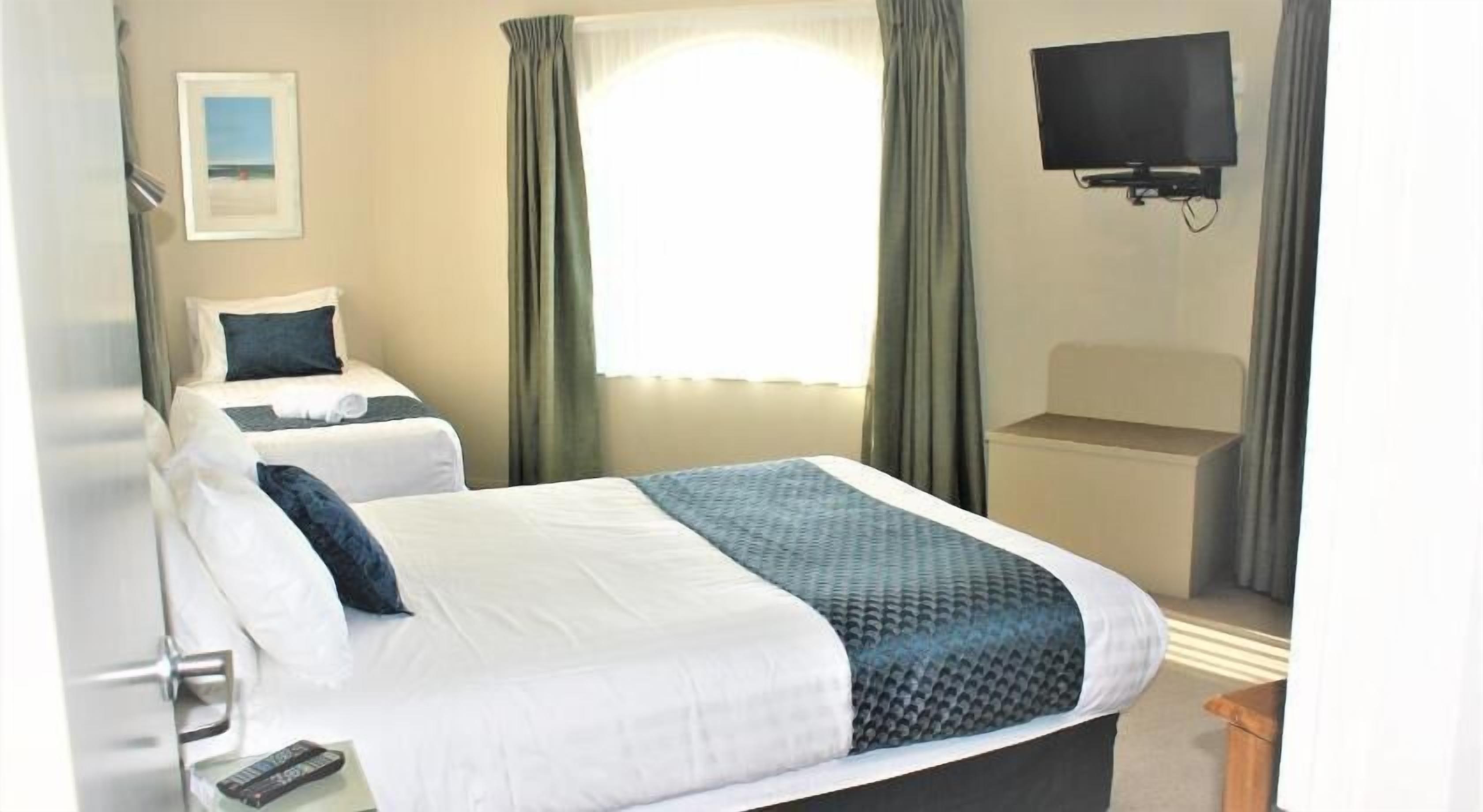 Premium bedding, desk, laptop workspace, soundproofing