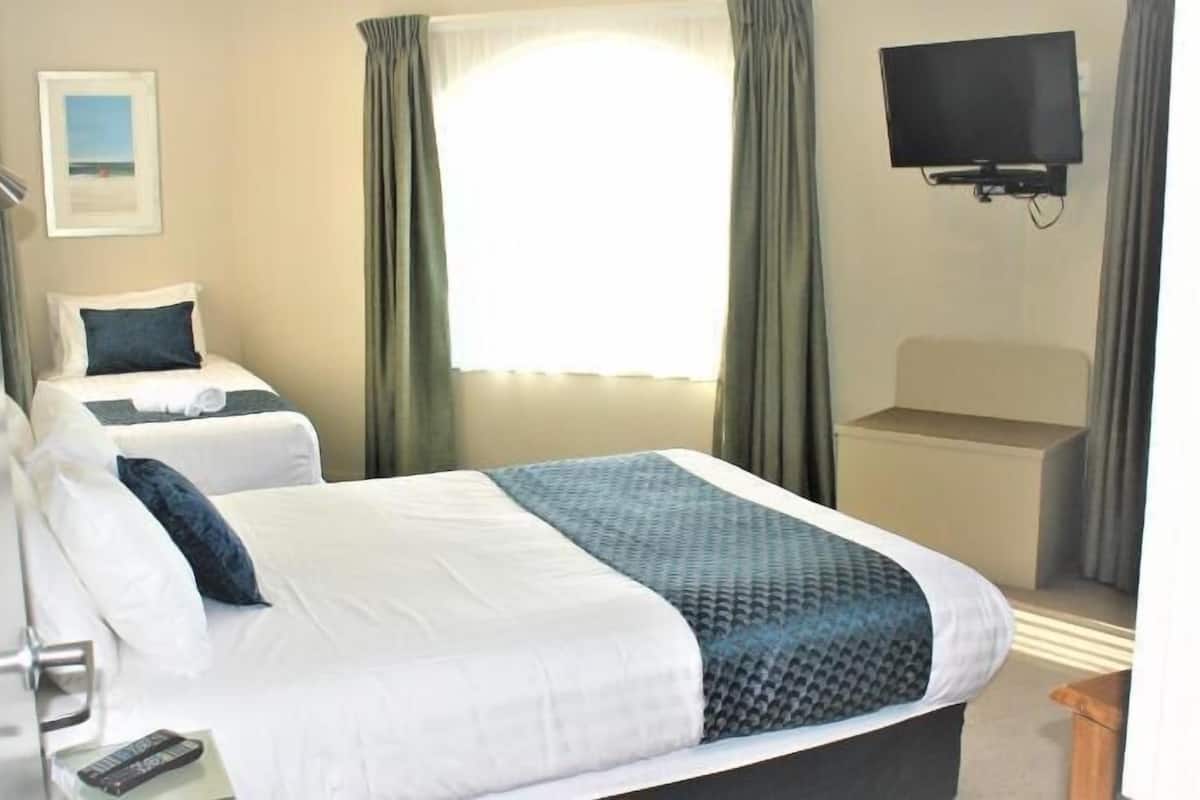 Premium bedding, desk, laptop workspace, soundproofing