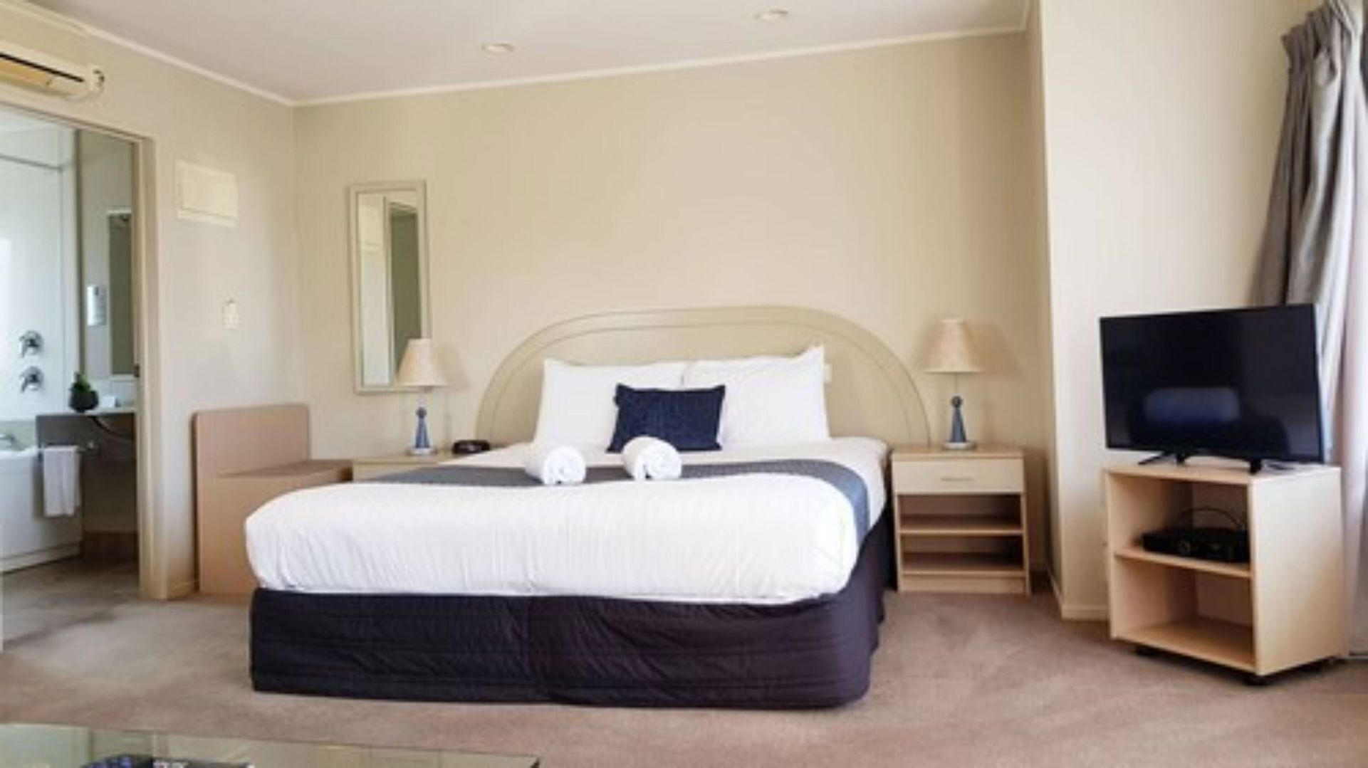 Premium bedding, desk, laptop workspace, soundproofing