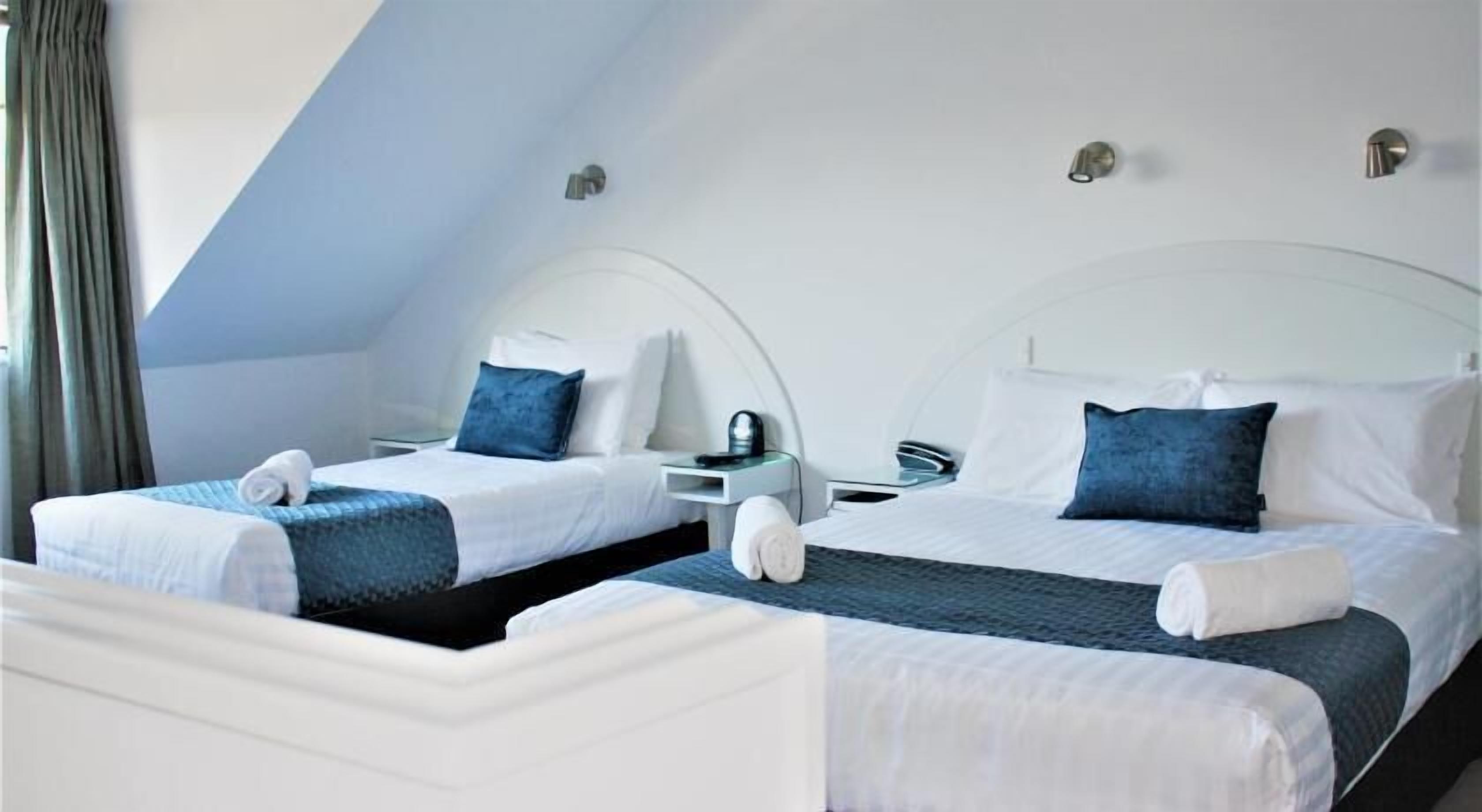 Premium bedding, desk, laptop workspace, soundproofing