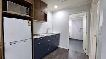 Family Apartment, 1 Bedroom (Disability Access) | Private kitchen | Fridge, microwave, coffee/tea maker, electric kettle