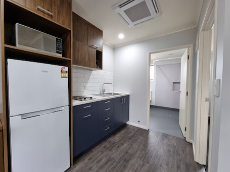 Family Apartment, 1 Bedroom (Disability Access) | Private kitchen | Fridge, microwave, coffee/tea maker, electric kettle