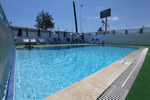 Seasonal outdoor pool, open 8:30 AM to 8:00 PM, free pool cabanas