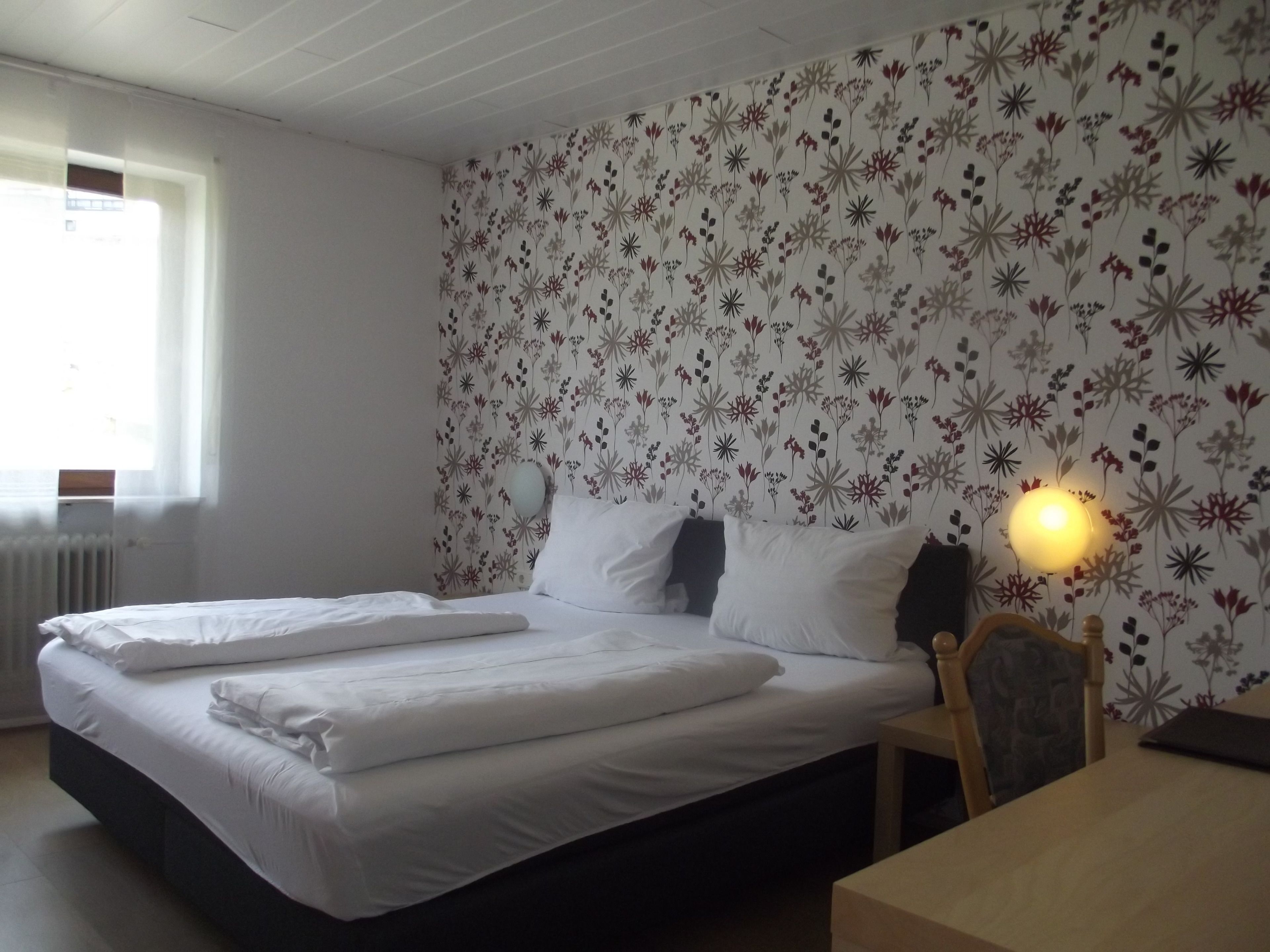 Premium bedding, desk, laptop workspace, blackout curtains