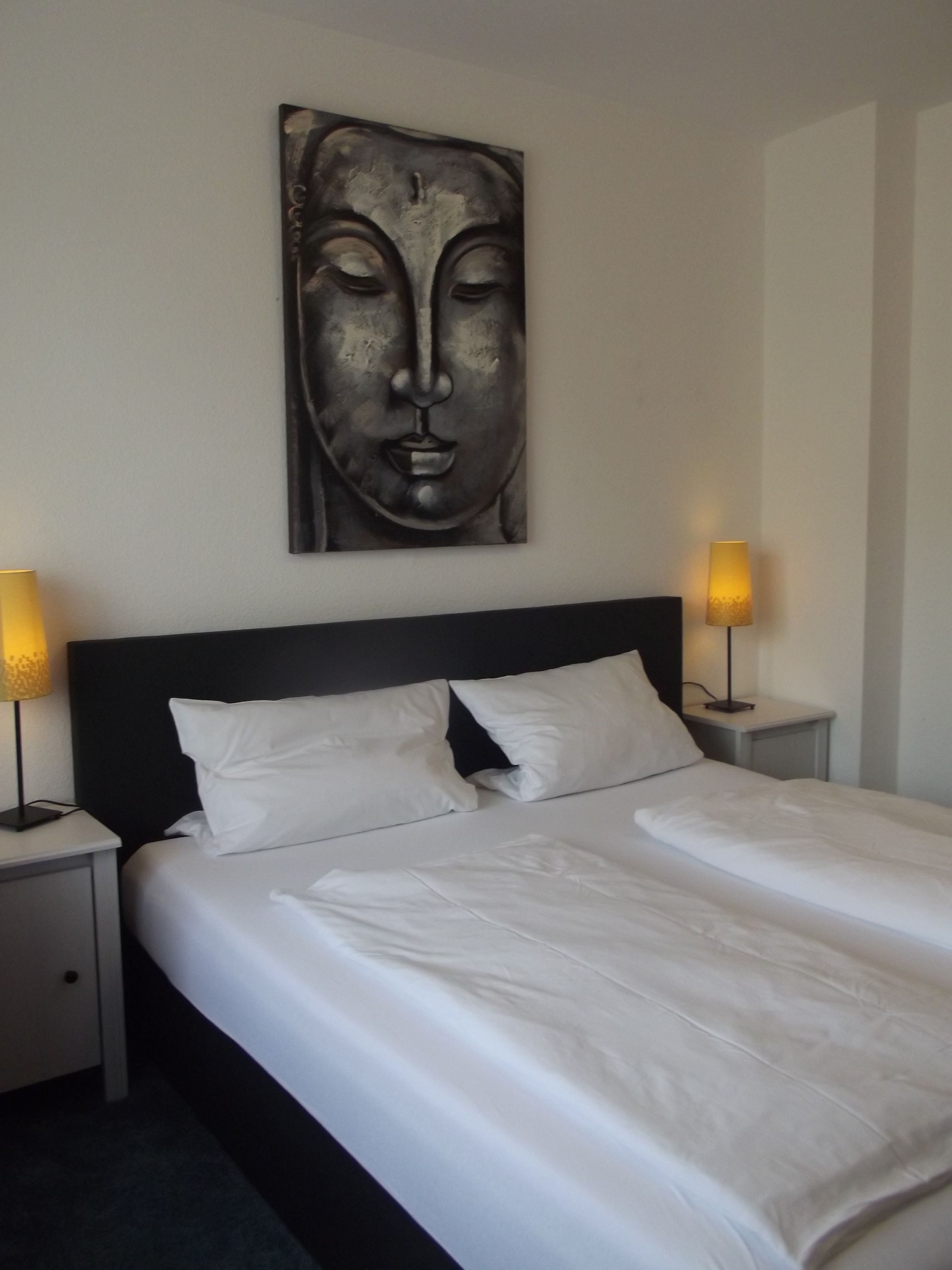 Premium bedding, desk, laptop workspace, blackout drapes