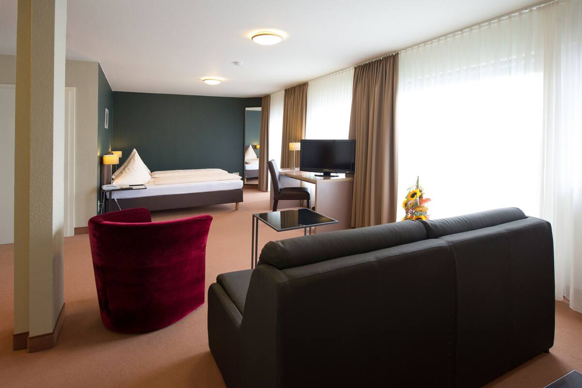 Suite with Balcony, Non Smoking, (Breakfast Excluded) | Hypo-allergenic bedding available, in-room safe, desk, blackout drapes