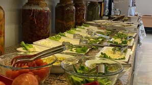 A buffet with various food items and condiments. - Sahil Hotel Pendik (Istanbul)