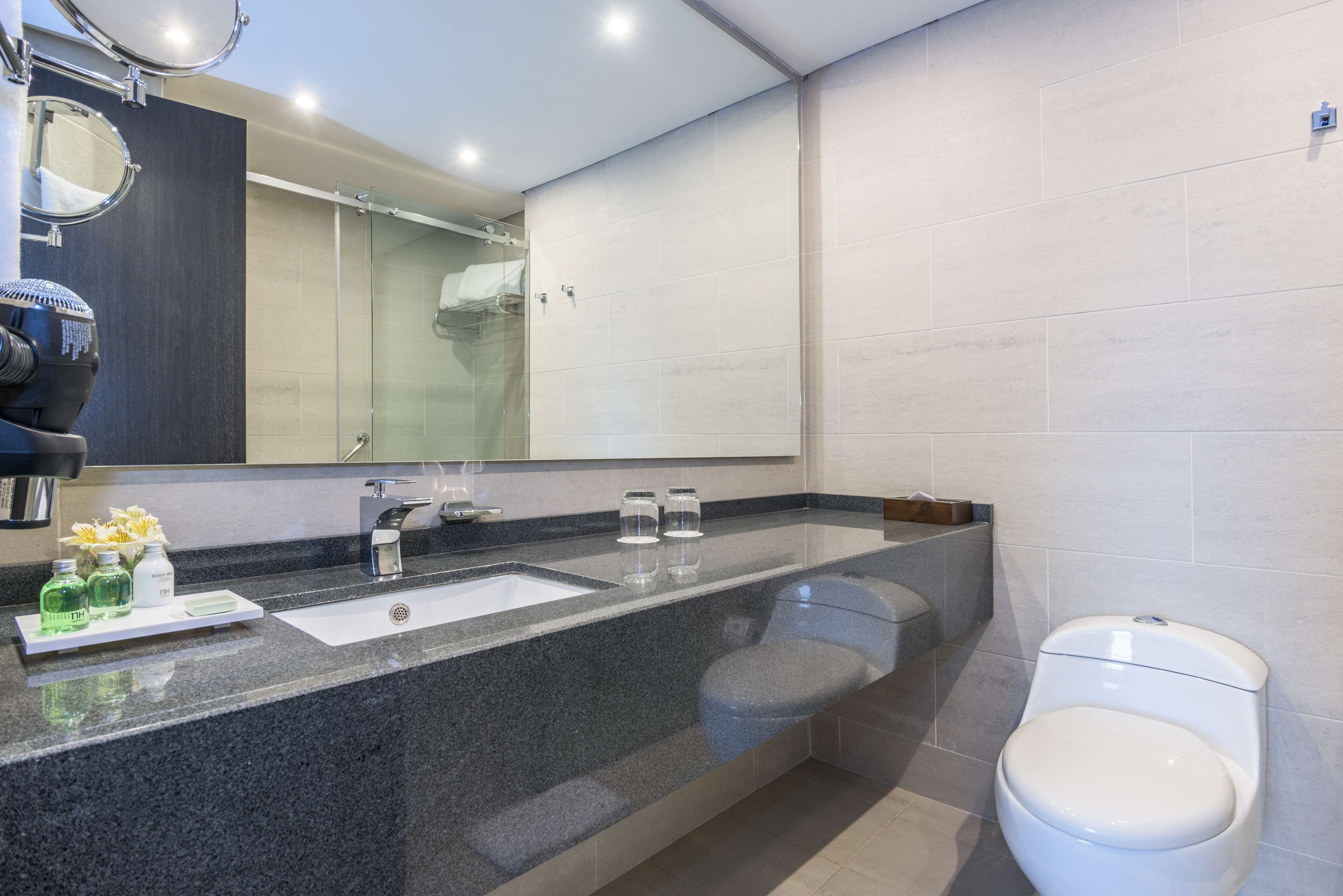 superior room | bathroom | shower, rainfall showerhead, eco-friendly toiletries, hair dryer