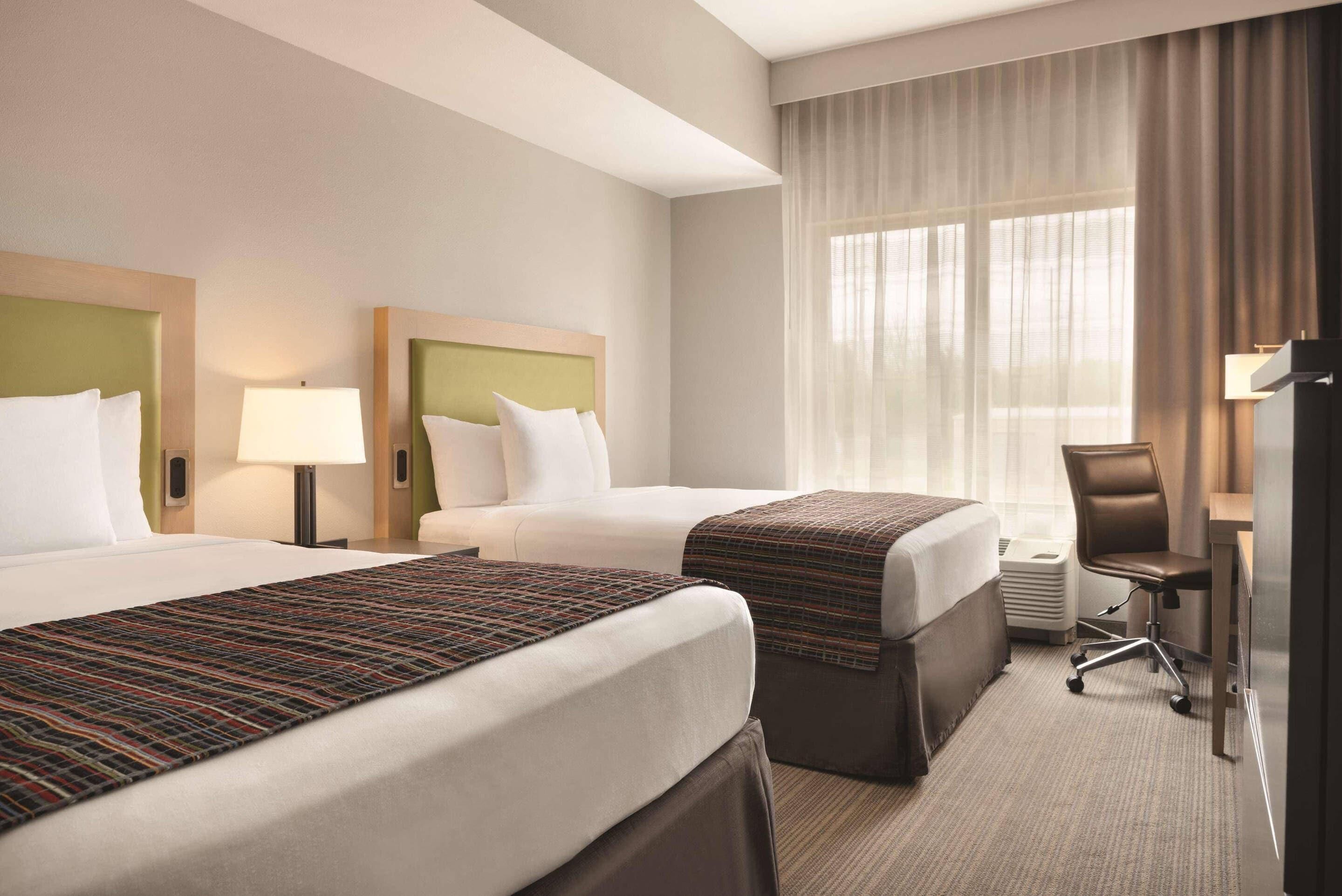 Pillow-top beds, desk, laptop workspace, blackout curtains