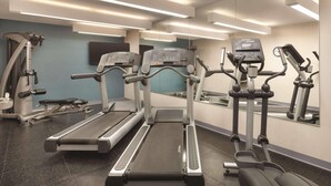 A gym with treadmills, elliptical machines, and a mirrored wall. - Country Inn & Suites by Radisson, Springfield Southeast (Springfield)
