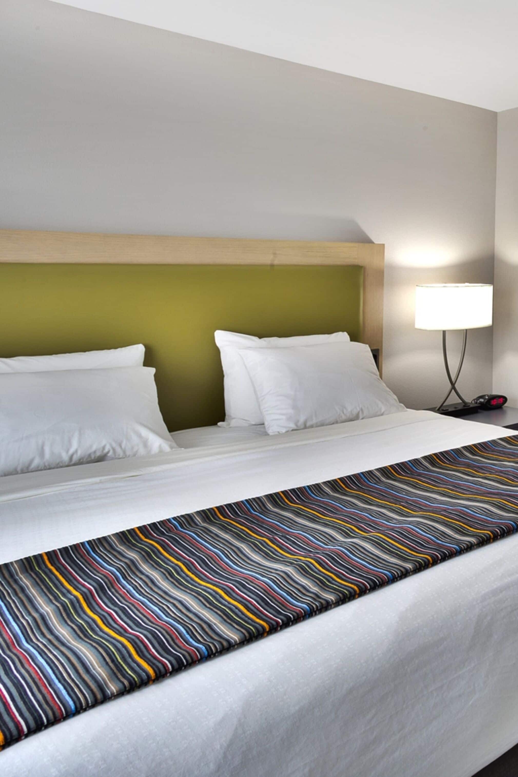 pillow-top beds, desk, laptop workspace, blackout curtains