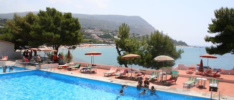 Outdoor pool, a lap pool, pool umbrellas, pool loungers