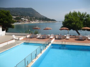 Outdoor pool, a lap pool, pool umbrellas, sun loungers