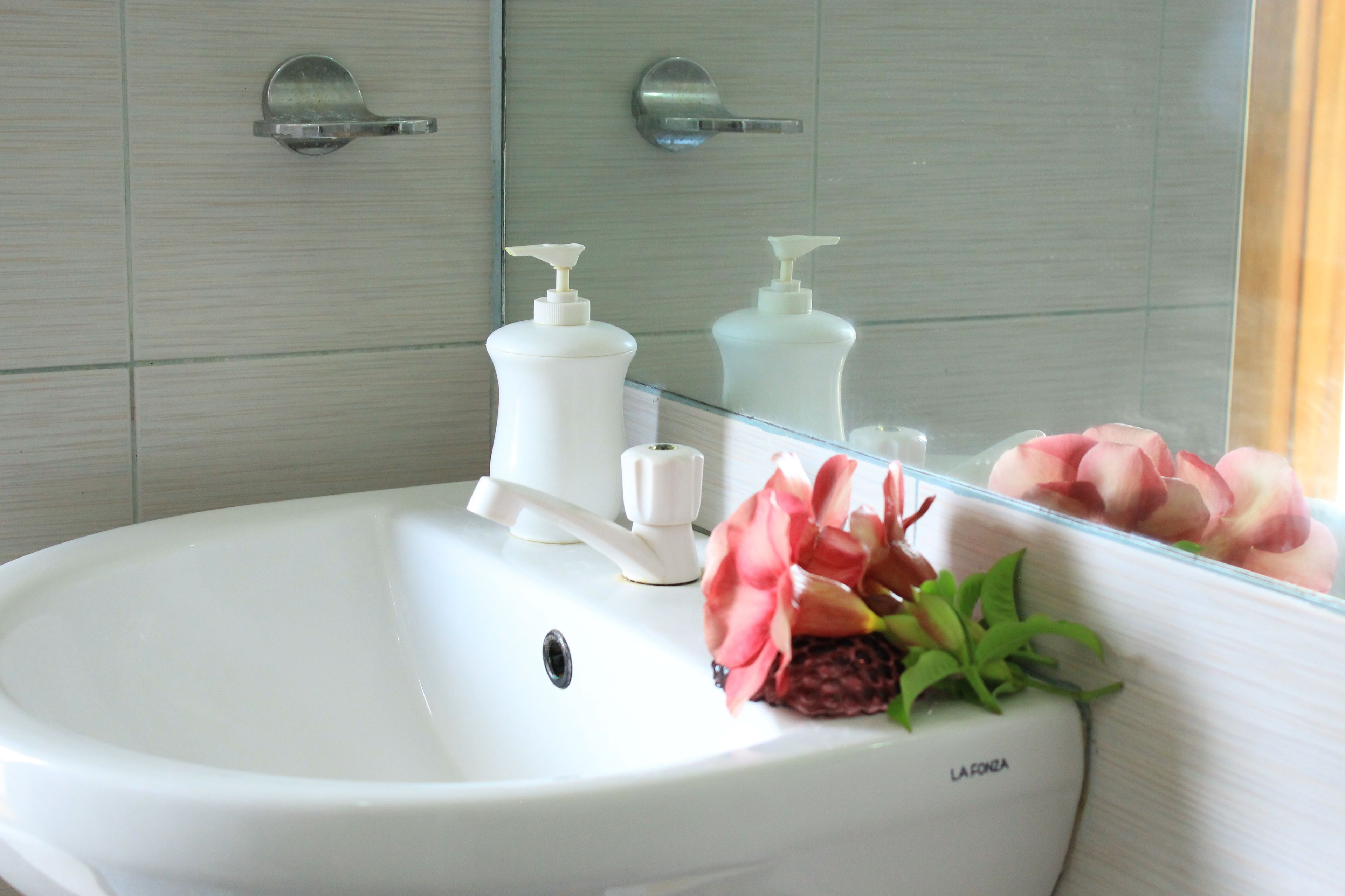 standard pool view twin bed | bathroom sink