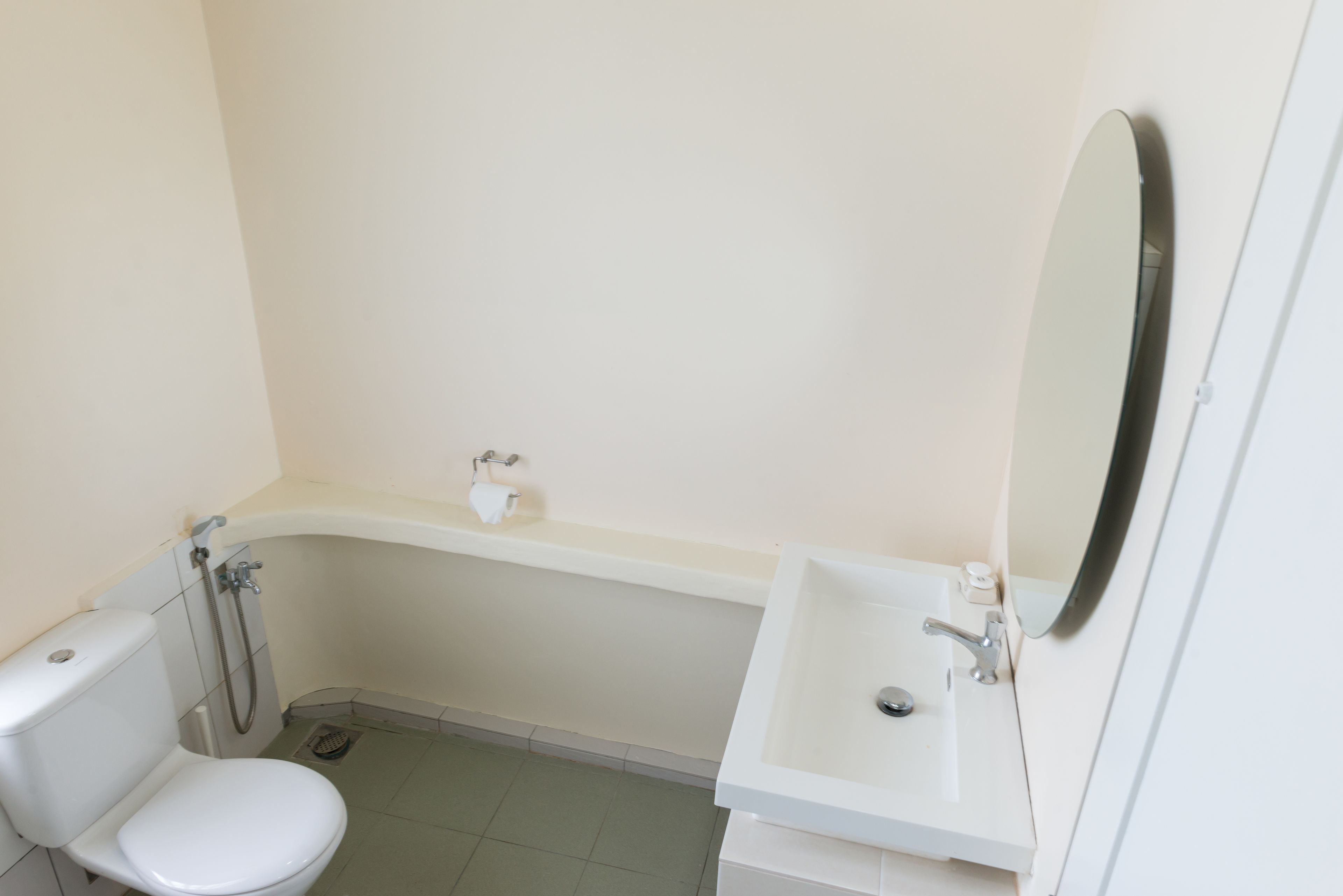 A bathroom with a toilet, a sink, and a bathtub.