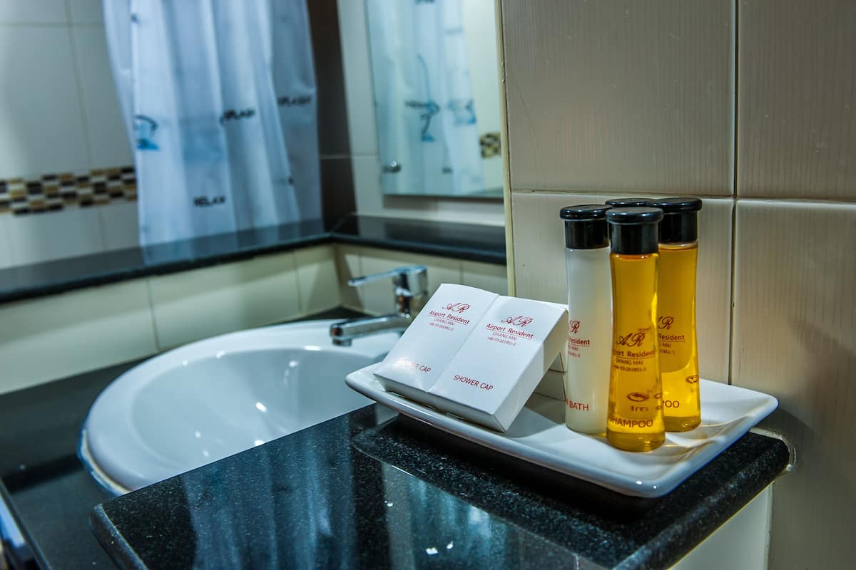 one bedroom grand suite | bathroom | shower, free toiletries, towels