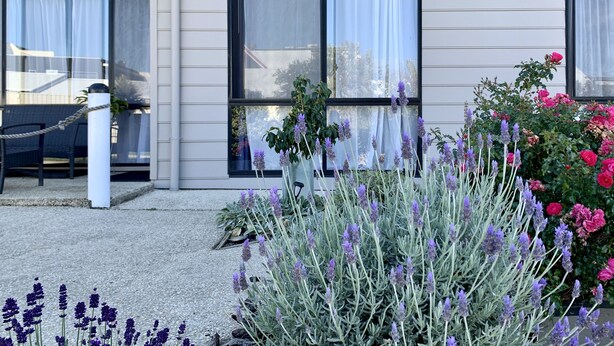A building with a sign reading "16 Garden Apartment" and a visible entrance. - Apollo Bay Waterfront Motor Inn (Apollo Bay)