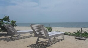 On the beach, sun loungers, beach umbrellas, beach towels