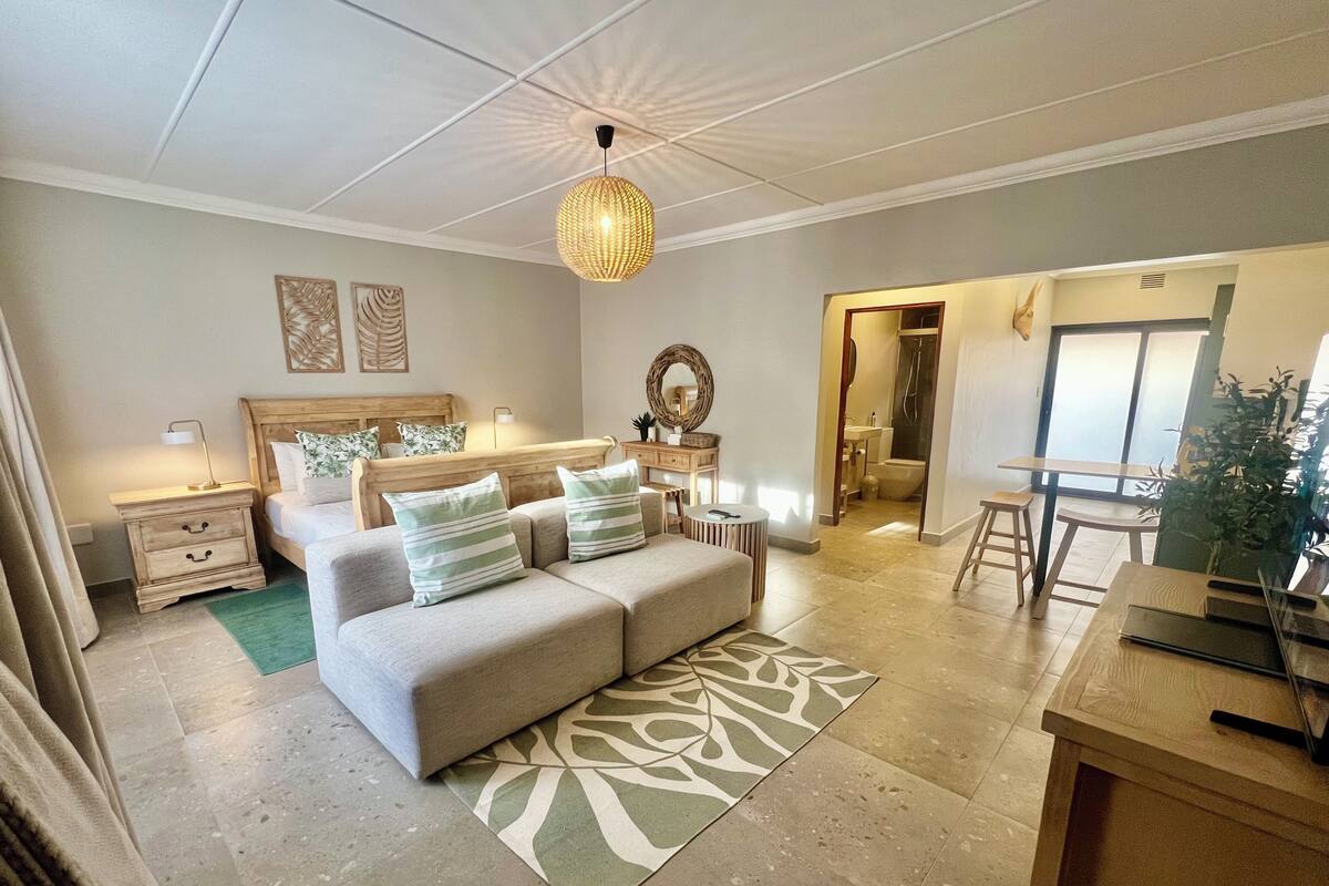 Deluxe Apartment, 1 Bedroom, Garden Area | Living area | 64-inch Smart TV with satellite channels
