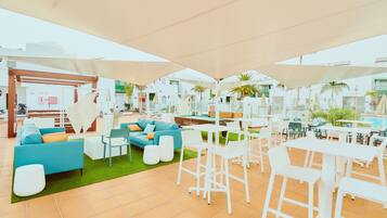 Relax in style with comfortable seating options under spacious shade structures.