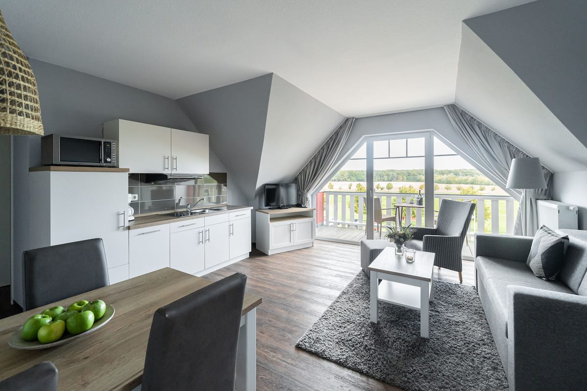 apartment, 1 bedroom, balcony | living area | flat-screen tv