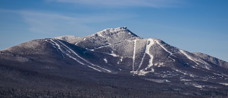 Experience the rugged beauty of the mountain landscape, where ski trails wind through the terrain.