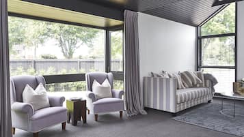 Three Bedroom Apartment | Living room | 32-inch flat-screen TV with digital channels, TV