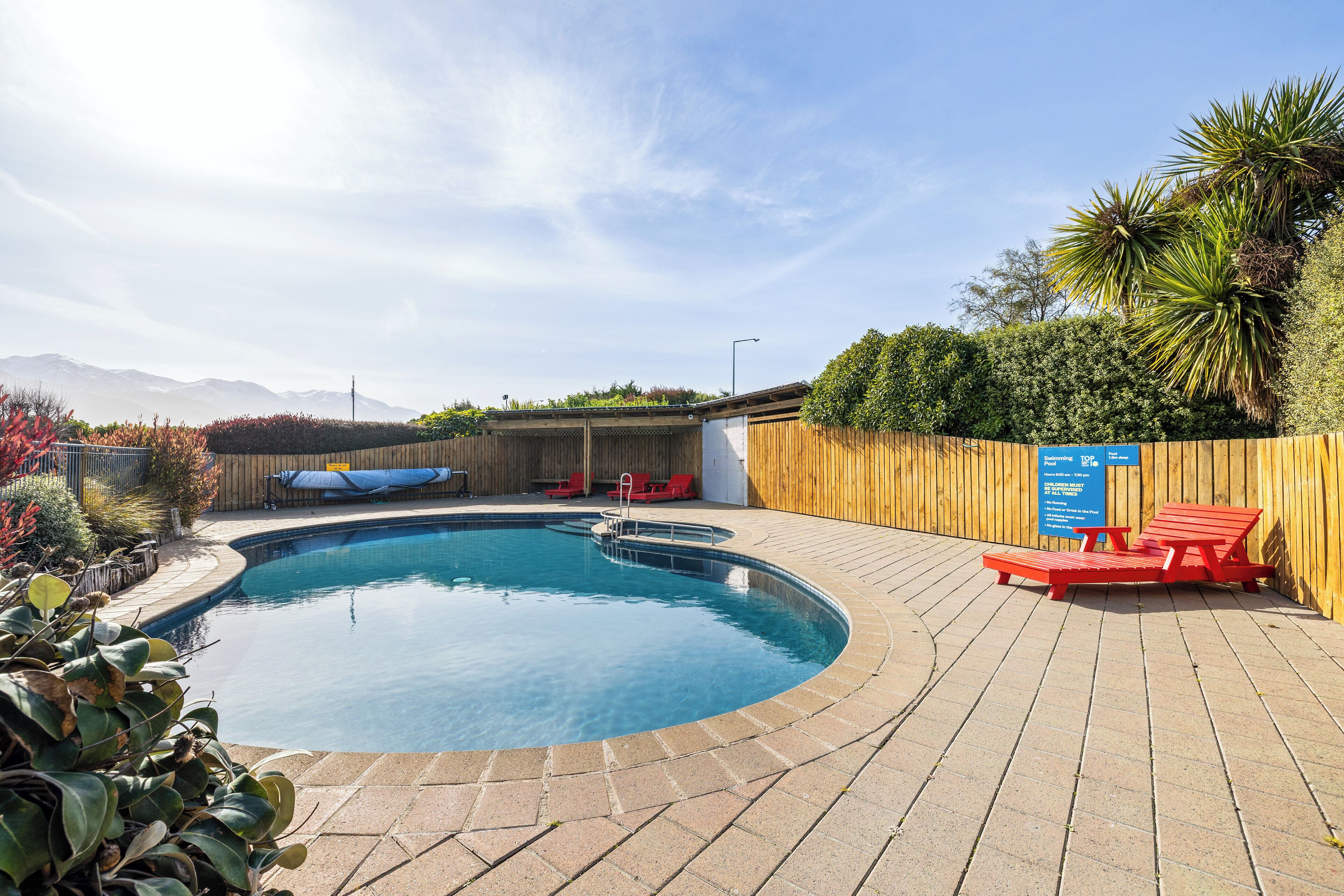 Seasonal outdoor pool, pool loungers