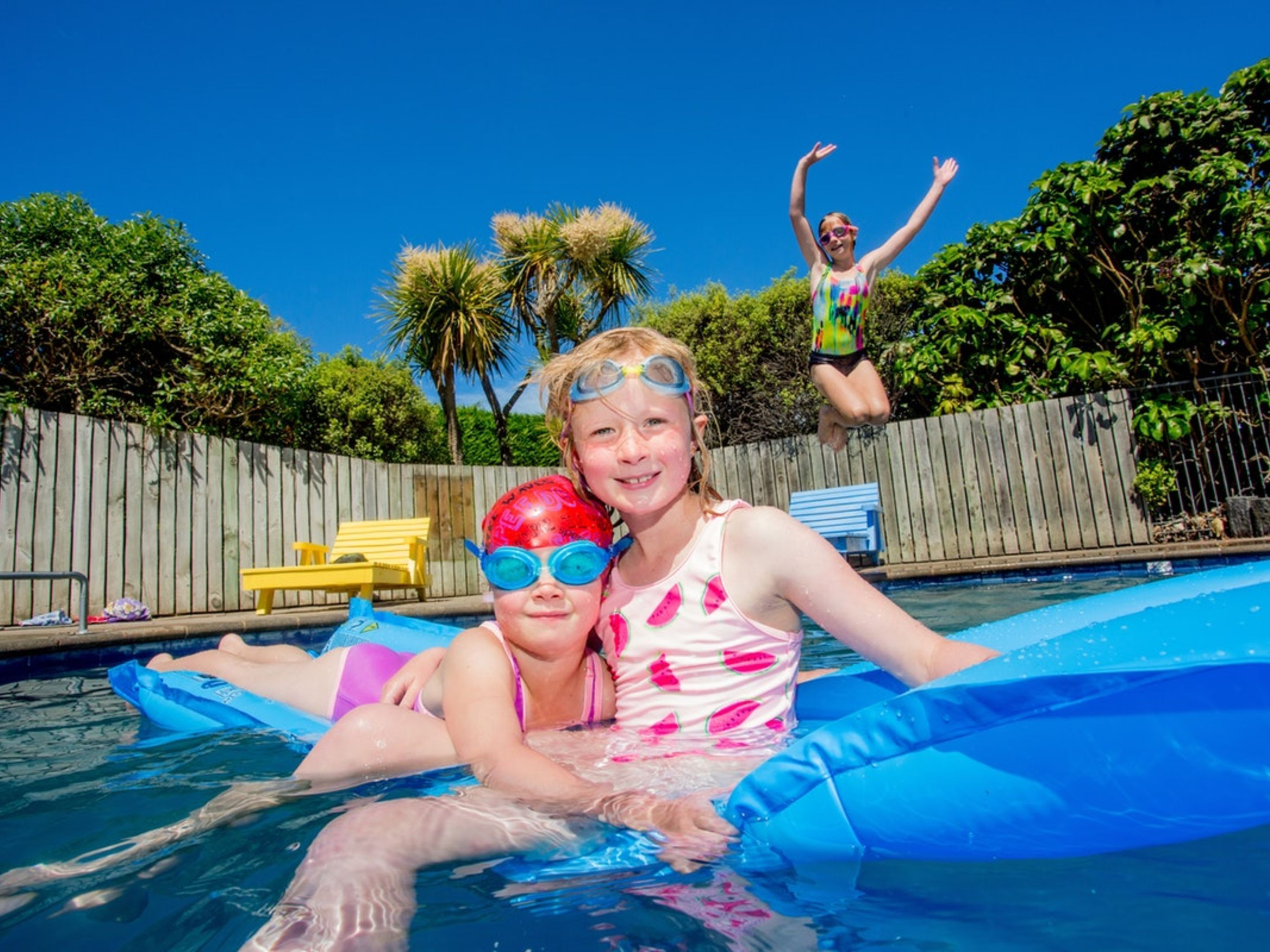 Seasonal outdoor pool, pool loungers