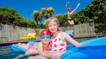 Seasonal outdoor pool, pool loungers
