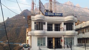A two-story building with a sign reading "HOTEL ISHAN". - Hotel Ishan (Reasi)